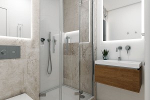 Moderní koupelna Mini využívá klasického optického efektu světlých ploch. Fádnost bílé doplňují světle šedé dlaždice z  kolekce Blend, připomínající beton původních, starých konstrukcí. Asymetrický tvar koutu přidal centimetry pro pohodlné sprchování. FOTO PERFECTO DESIGN