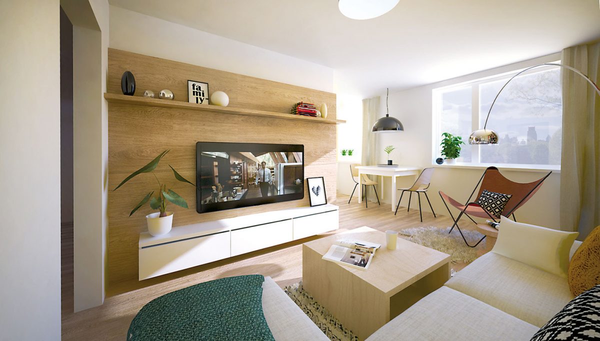 TV stěna na pozadí přírodního dřeva má prostor zútulnit. Aby působila vzdušněji, úložné prostory jsou navrženy jako zavěšené a odsazené od obou stran.