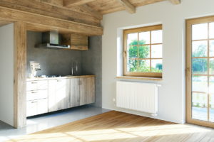 Venkkovská kuchyň s velkým oknem a radiatorem