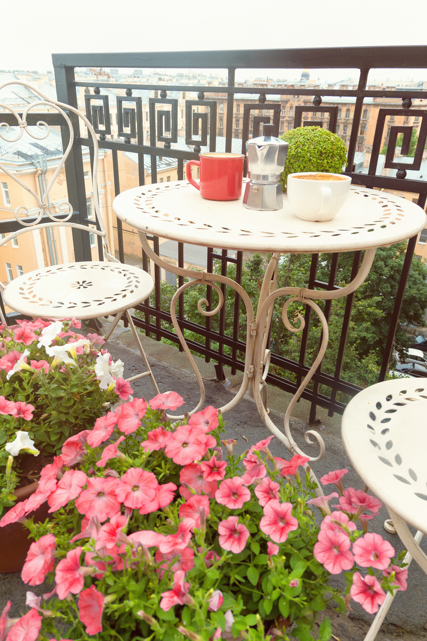 Coffee cups on table on romantic balcony