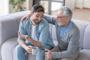 Senior,Old,Elderly,Man,Discussing,,Talking,,,Supporting,His,Adult