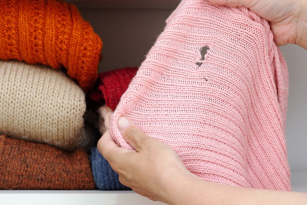 Cropped,Woman,Hands,Holding,Woolen,Knitted,Cloth,With,Hole,Made