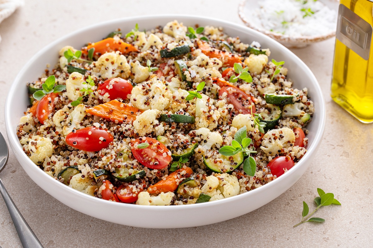 Quinoa salad with roasted vegetables and fresh herbs and tomatoes.