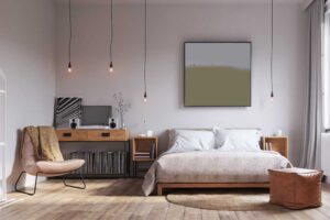 Ložnice s postelí a volným prostorem u topení která umožňuje rovnoměrné šíření tepla