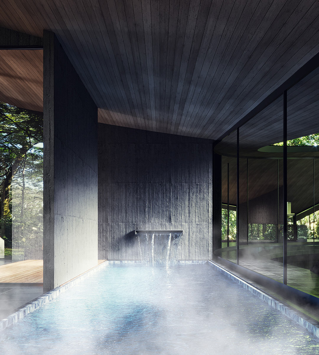 Soukromý onsen s horkou vodou navazuje na tmavé materiály wellness zóny a nabízí výhled do okolního lesa.