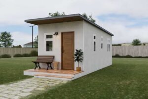 Moderní tiny house s minimalistickou fasádou a malou terasou před vstupem.