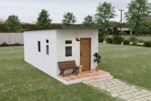 Tiny house v zahradě s plochou střechou a kompaktními proporcemi.
