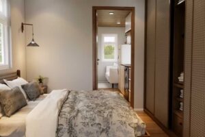 Ložnice v tiny house s velkou postelí a vestavěnou šatní skříní.