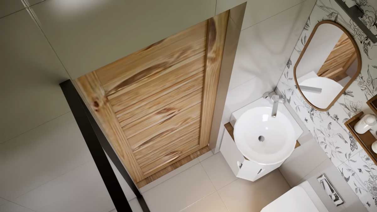 Koupelna v tiny house s umyvadlem a posuvnými dřevěnými dveřmi.