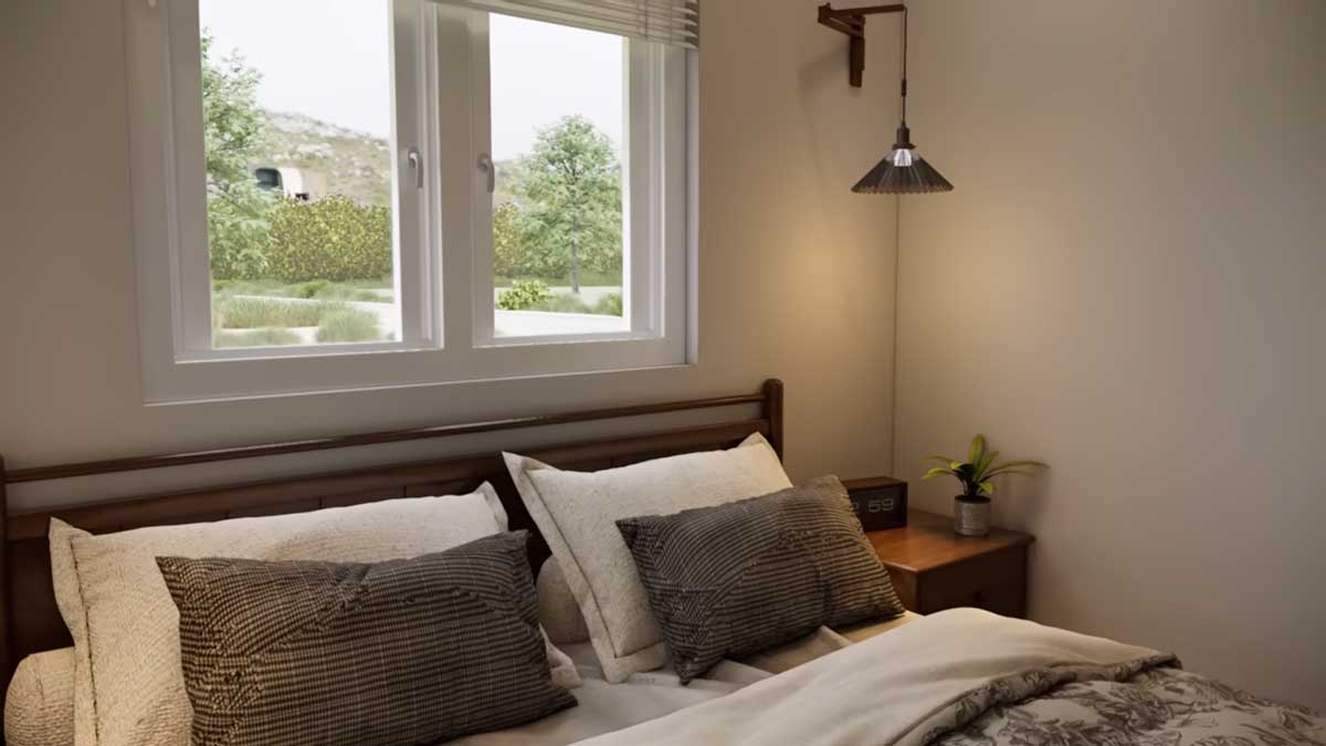 Ložnice s oknem nad postelí, které přivádí přirozené světlo do prostoru.